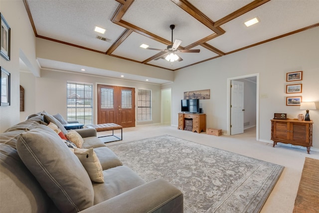 living room featuring light carpet, ornamental molding, and ceiling fan