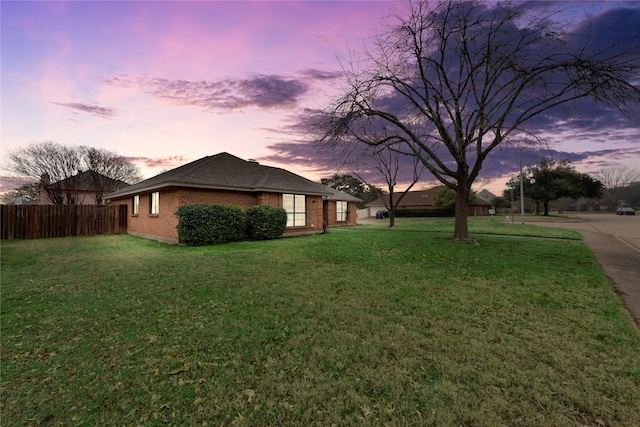 view of yard at dusk