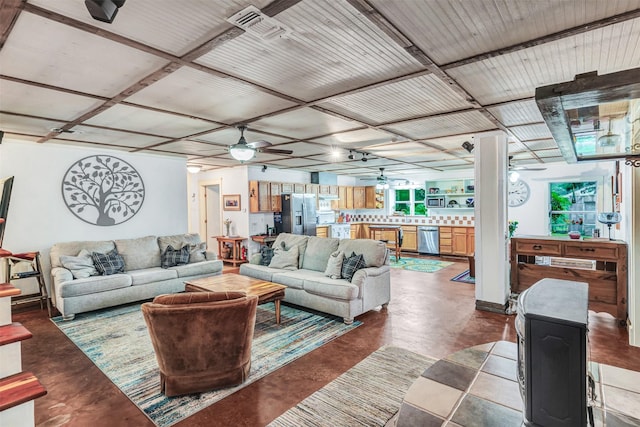 living room featuring concrete floors and ceiling fan