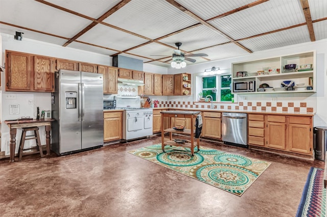 kitchen featuring tasteful backsplash, ceiling fan, appliances with stainless steel finishes, and sink