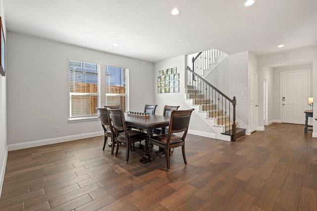 dining area with dark hardwood / wood-style floors