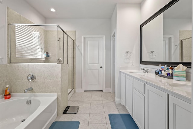 bathroom featuring vanity, tile patterned floors, and independent shower and bath