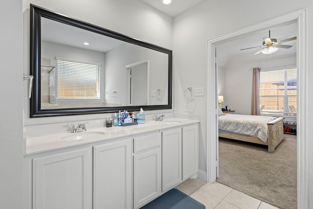 bathroom featuring tile patterned flooring, vanity, and ceiling fan