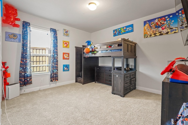 bedroom featuring light colored carpet