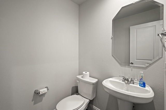 bathroom with sink and toilet