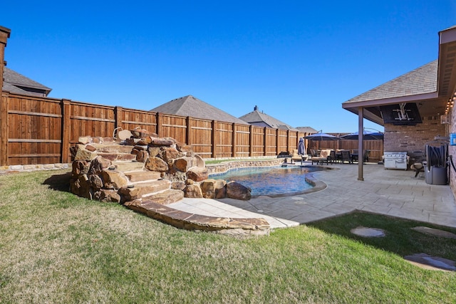 exterior space with a fenced in pool and a patio