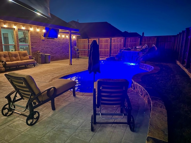 view of patio / terrace featuring a fenced in pool