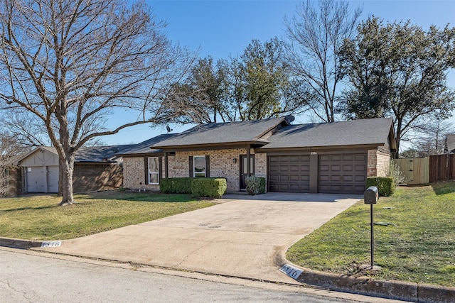 single story home with a garage and a front lawn