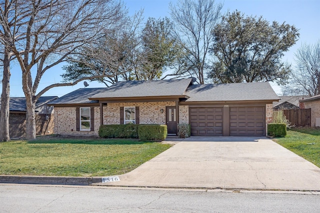 view of front of house with a garage and a front yard