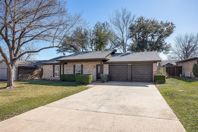 ranch-style house featuring a garage and a front yard