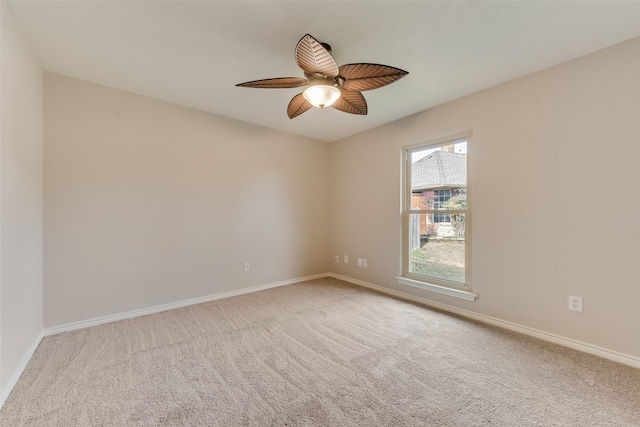 empty room with light carpet and ceiling fan