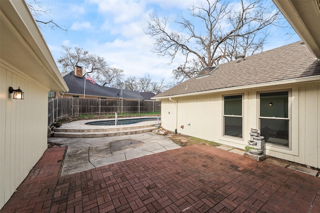 view of patio / terrace with a fenced in pool