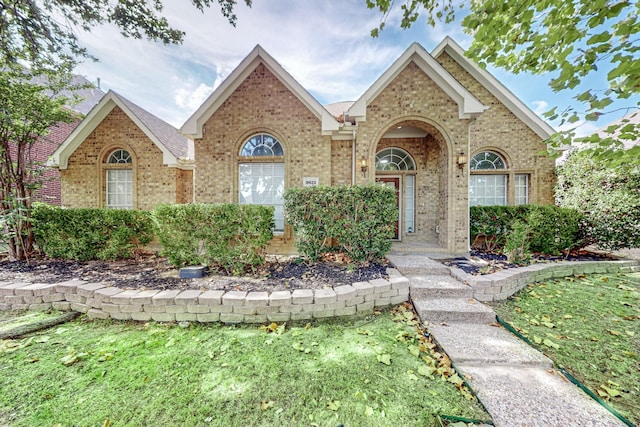 ranch-style home with a front lawn