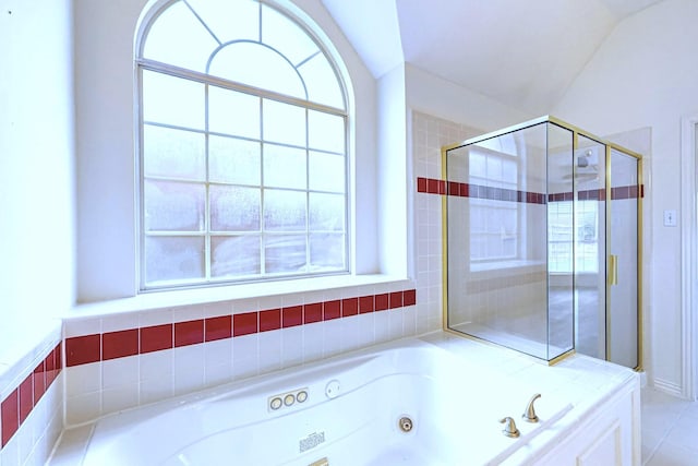 bathroom with vaulted ceiling and shower with separate bathtub