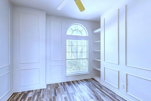 interior space featuring hardwood / wood-style floors and ceiling fan