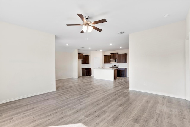 unfurnished living room with light hardwood / wood-style floors and ceiling fan