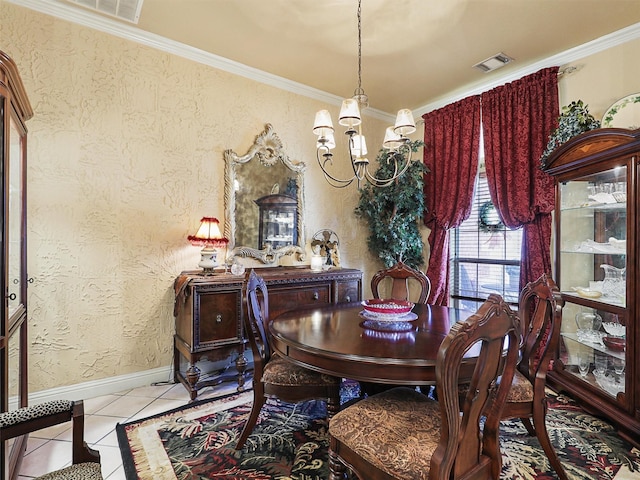 dining room with light tile patterned flooring, ornamental molding, and a chandelier