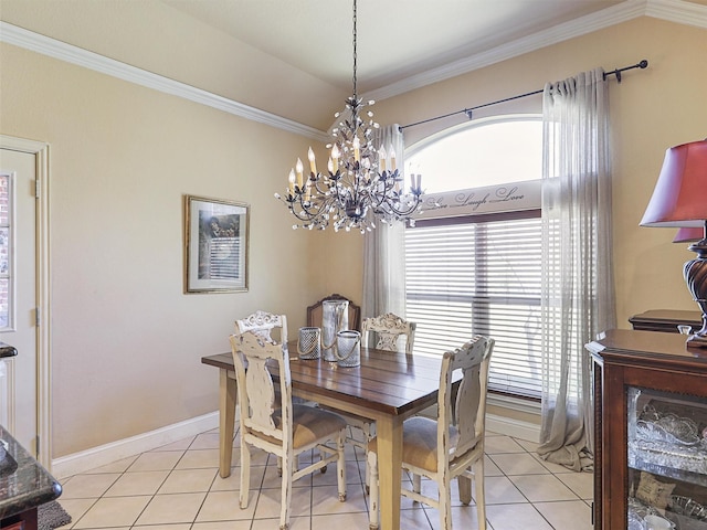 tiled dining area featuring ornamental molding and a chandelier