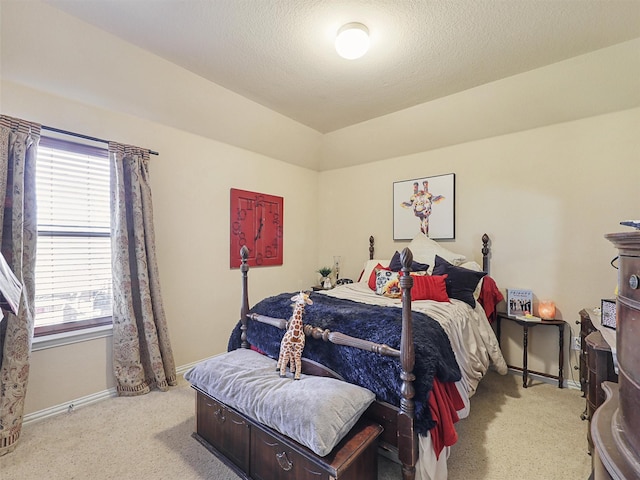 carpeted bedroom with a textured ceiling