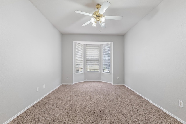 unfurnished room featuring carpet and ceiling fan