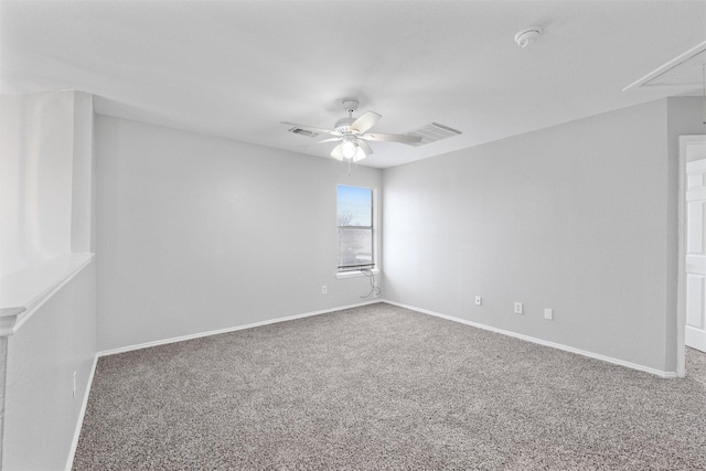 empty room with ceiling fan and carpet