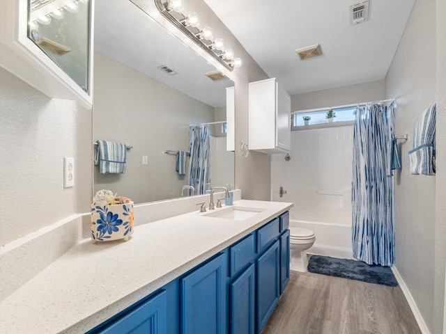 full bathroom featuring toilet, vanity, shower / bathtub combination with curtain, and hardwood / wood-style floors