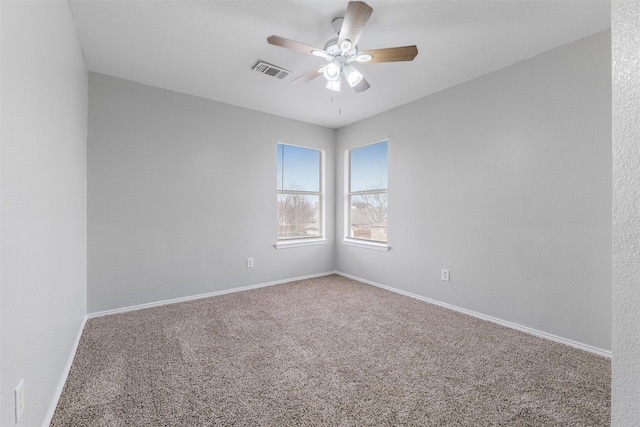 unfurnished room featuring carpet flooring and ceiling fan