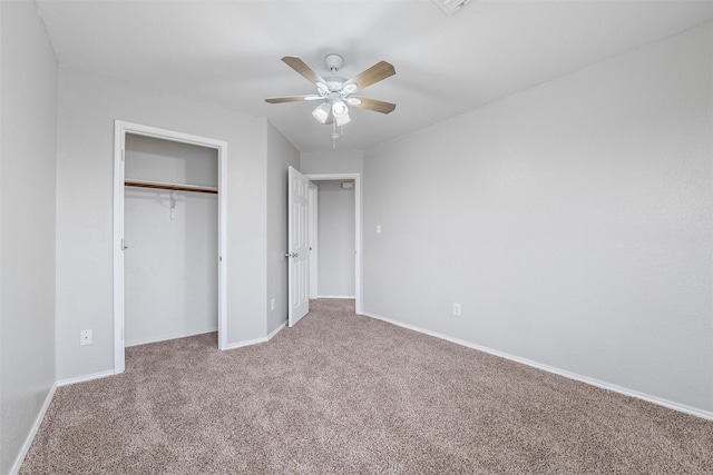 unfurnished bedroom featuring ceiling fan, carpet flooring, and a closet