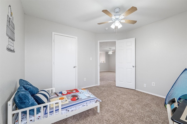 carpeted bedroom with ceiling fan