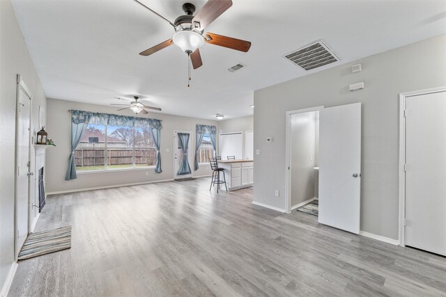 unfurnished living room with light hardwood / wood-style flooring