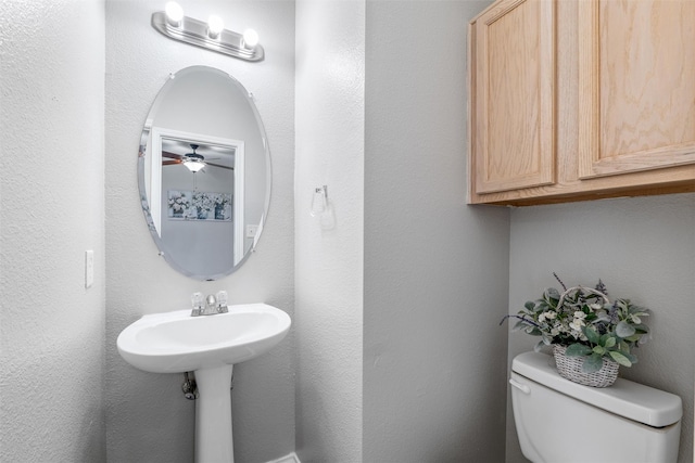 bathroom with toilet and sink