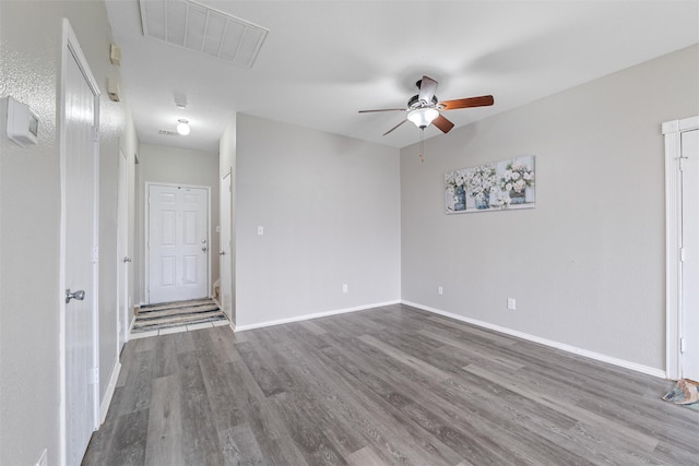 empty room featuring ceiling fan and wood-type flooring