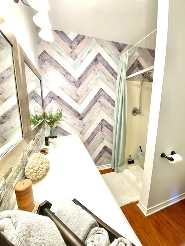 bathroom featuring walk in shower and parquet flooring