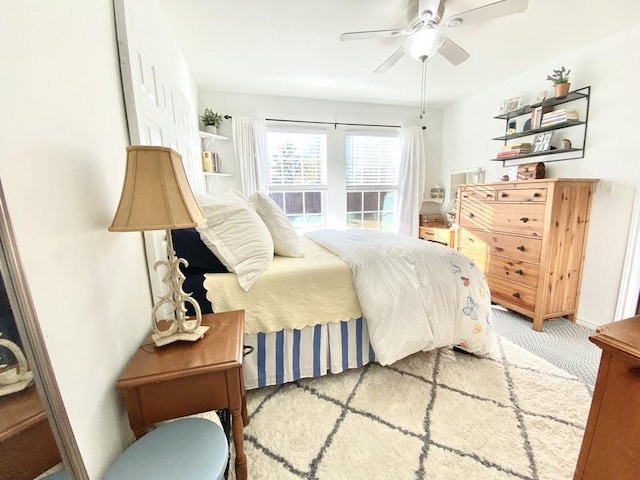 carpeted bedroom featuring ceiling fan