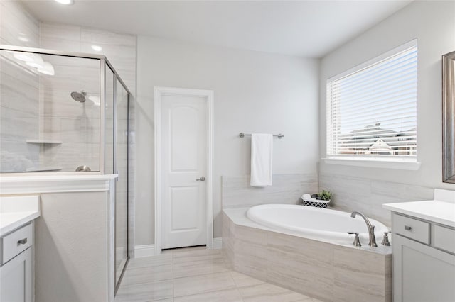 bathroom with vanity and plus walk in shower