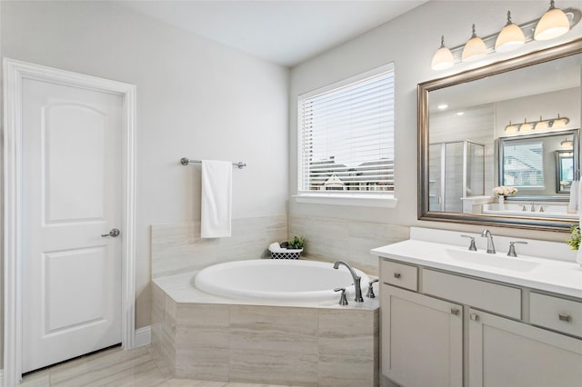 bathroom featuring vanity and separate shower and tub