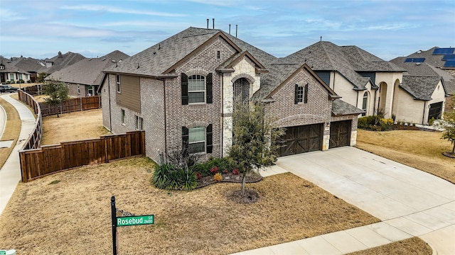 view of front of home featuring a garage and a front lawn