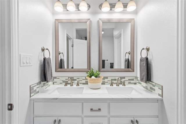 bathroom with vanity and decorative backsplash