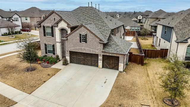 view of front of house featuring a garage and a front yard