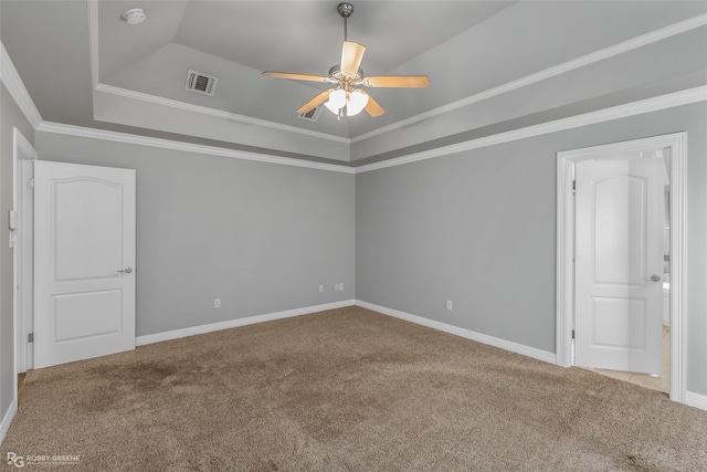 unfurnished room featuring crown molding, ceiling fan, a raised ceiling, and light carpet