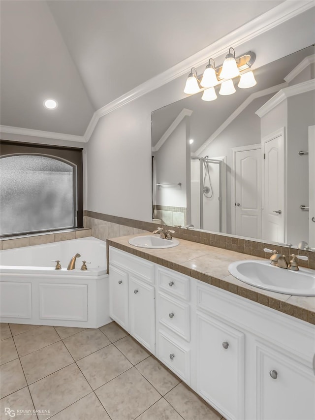 bathroom featuring lofted ceiling, tile patterned floors, vanity, ornamental molding, and plus walk in shower