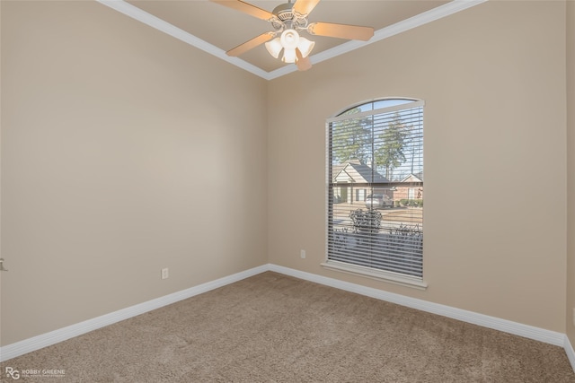 carpeted spare room with ornamental molding and ceiling fan