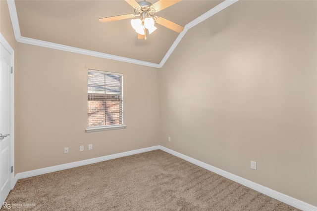 carpeted empty room featuring crown molding, lofted ceiling, and ceiling fan