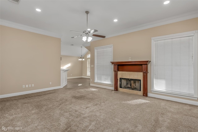 unfurnished living room featuring a fireplace, ornamental molding, ceiling fan, and carpet