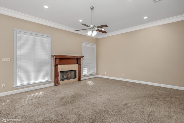 unfurnished living room with ornamental molding, a fireplace, and carpet floors