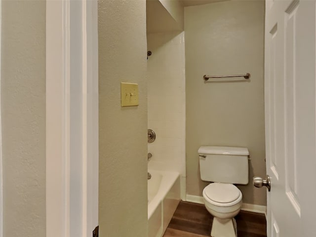 bathroom with hardwood / wood-style floors and toilet