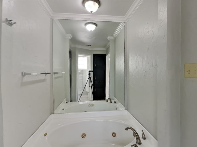 bathroom with a tub to relax in and ornamental molding