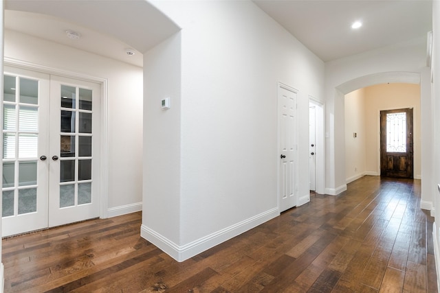 entrance foyer with french doors and dark hardwood / wood-style floors