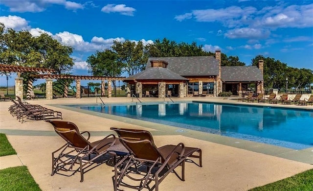 view of swimming pool featuring a patio area