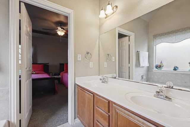 bathroom featuring vanity and ceiling fan